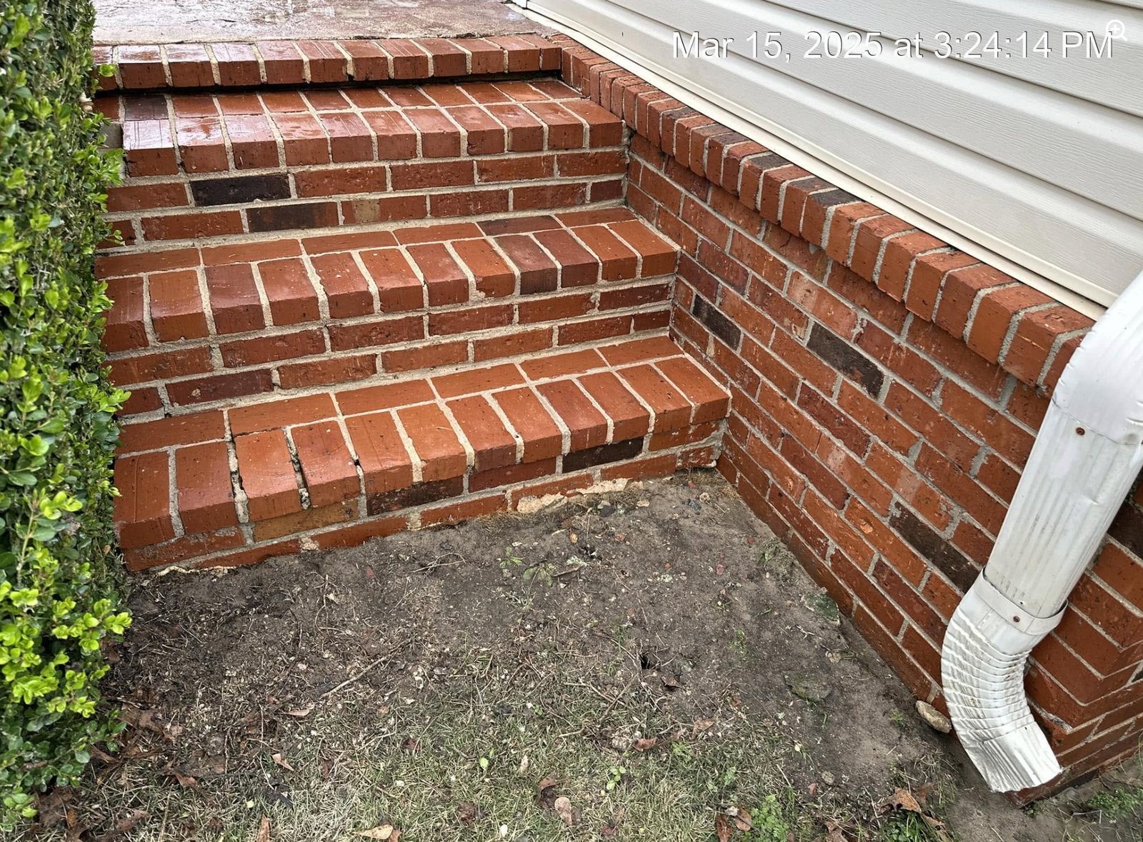 Same brick steps after exterior cleaning, with grime removed